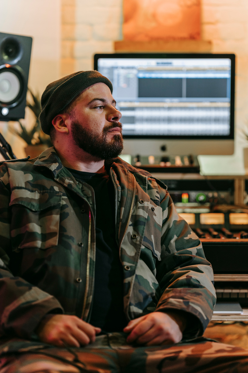 Bearded Man Sitting in a Recording Studio
